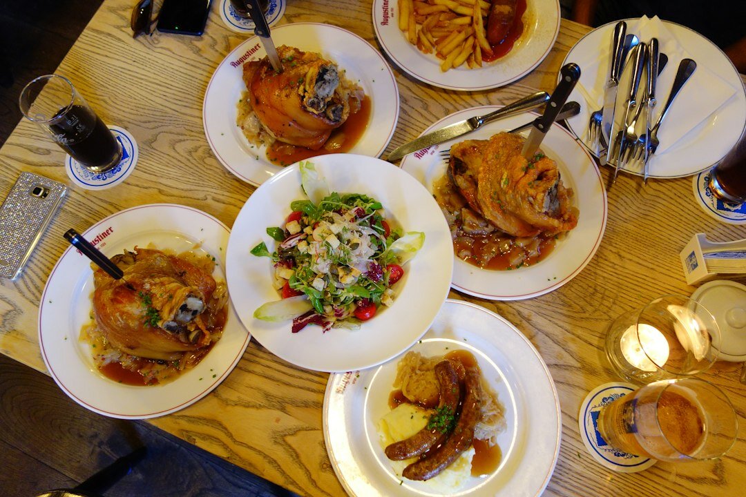 Traditional Czech svíčková dish with dumplings on a wooden table