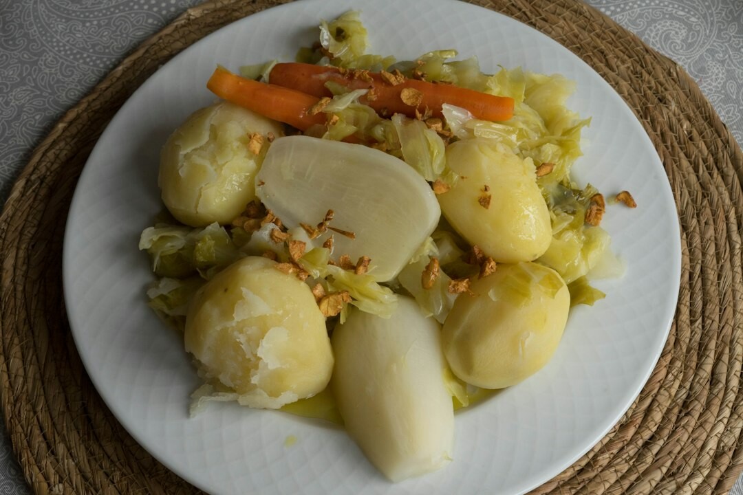 Simple homemade lunch with potatoes and vegetables on a plate
