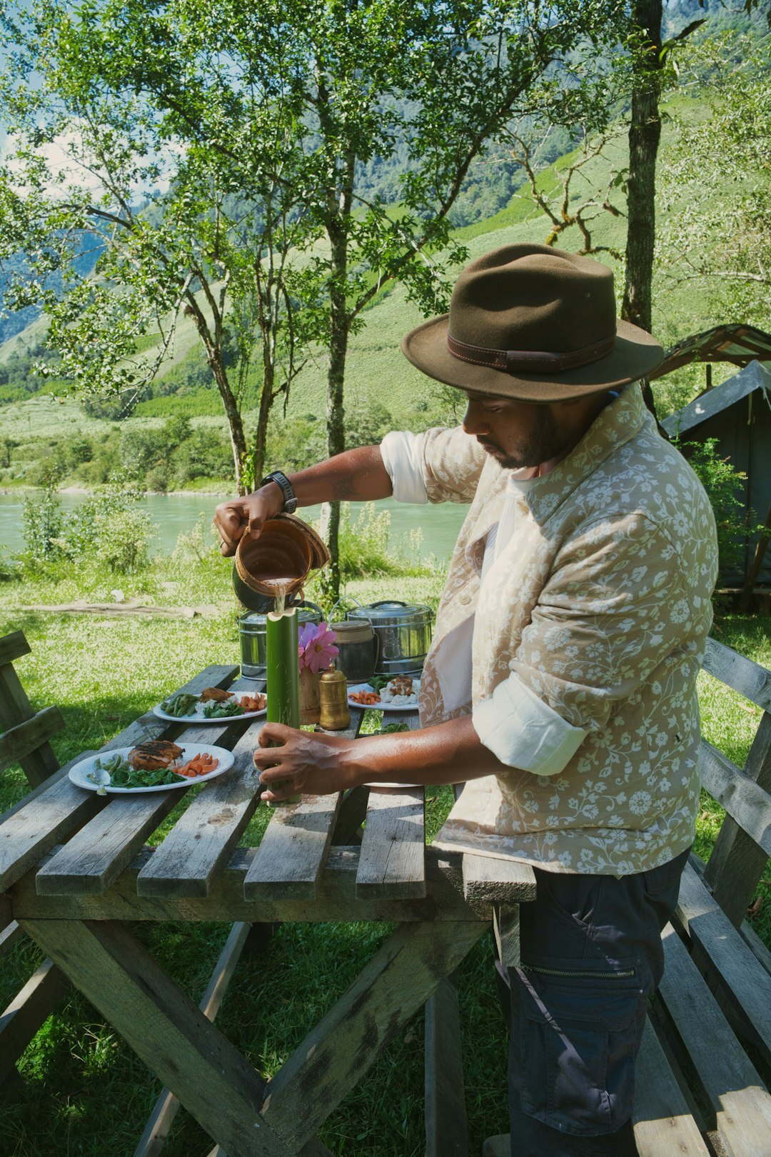 Grilled summer vegetables and meat on an outdoor table